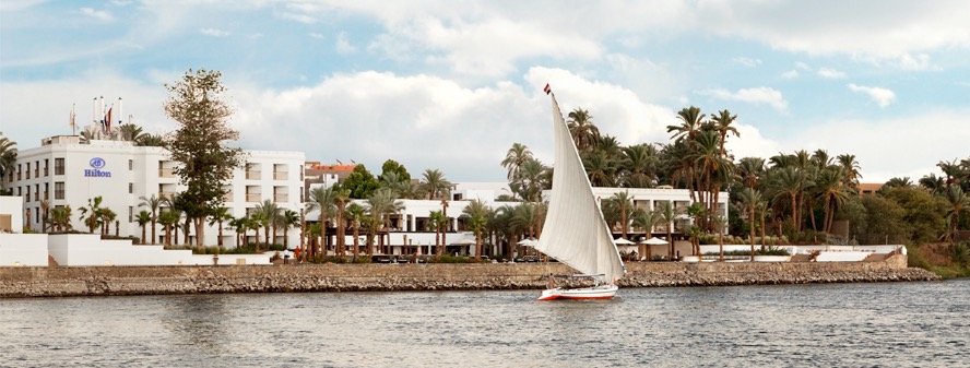 Hilton Luxor Resort on the Nile with sailboat