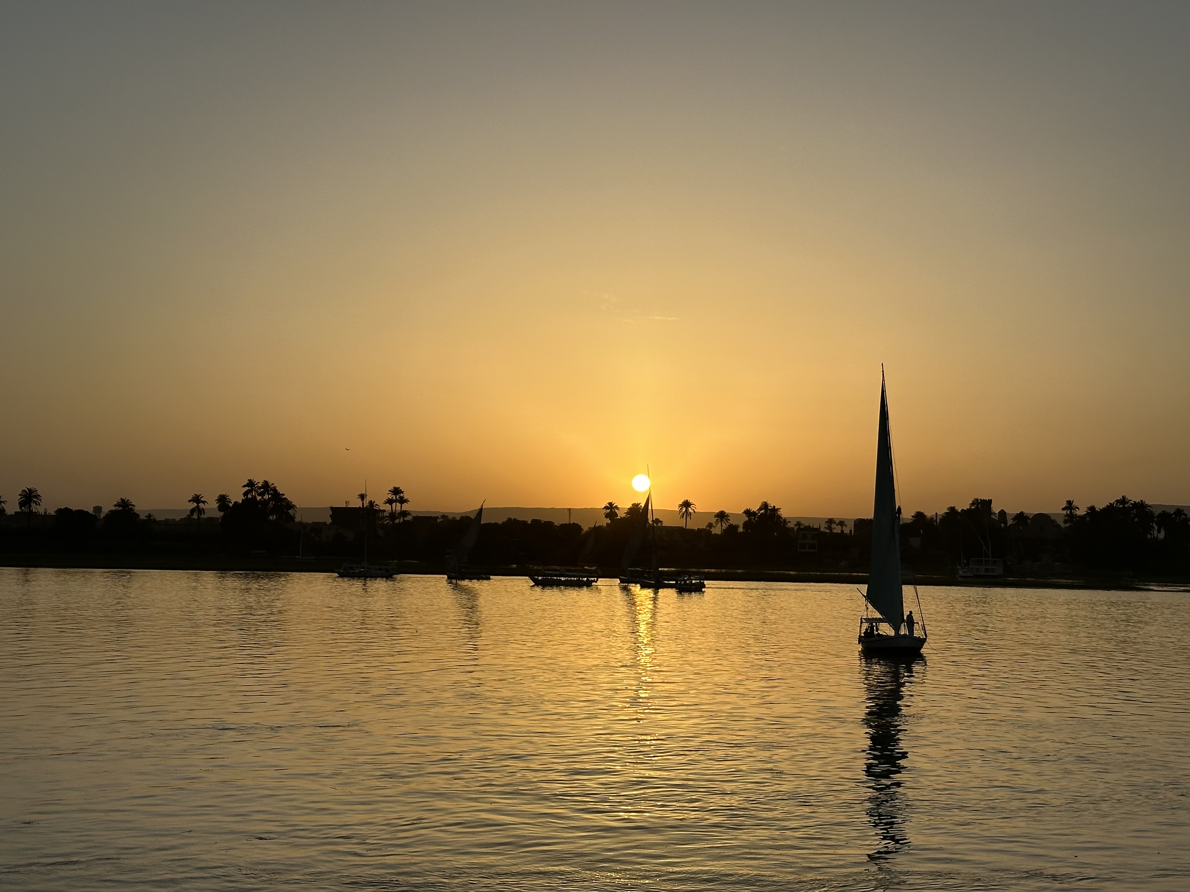 Sunset over Nile with sailboat